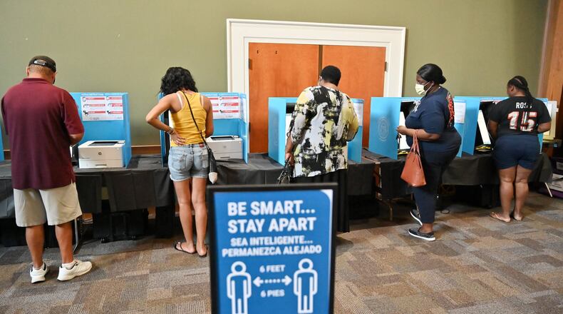 Gwinnett County residents cast their votes during the Georgia primary elections at Pleasant Hill Presbyterian Church in Duluth on Tuesday, June 9, 2020. (Hyosub Shin / Hyosub.Shin@ajc.com)