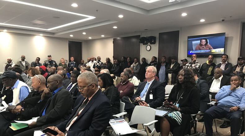 Dozens of taxi drivers showed up at an Atlanta city council transportation committee meeting on Feb. 15, 2017 to show their concern with a new taxi vehicle age limit.