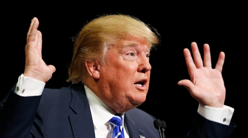 In this Oct. 8, 2015, photo Republican presidential candidate Donald Trump speaks at a rally in Las Vegas. Trump is expanding his paid campaign staff into several Southern states that will be key to selecting the Republican presidential nominee. Trumps advisers say its a sign hes committed to a long race, despite suggestions hes reconsidering his bid. (AP Photo/John Locher)