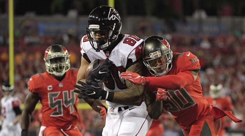 Game9.d Atlanta Falcons tight end Levine Toilolo (80) pulls in a 32-yard touchdown pass after getting pat Tampa Bay Buccaneers free safety Bradley McDougald (30) and outside linebacker Lavonte David (54) during the first quarter of an NFL football game Thursday, Nov. 3, 2016, in Tampa, Fla. (AP Photo/Phelan Ebenhack)