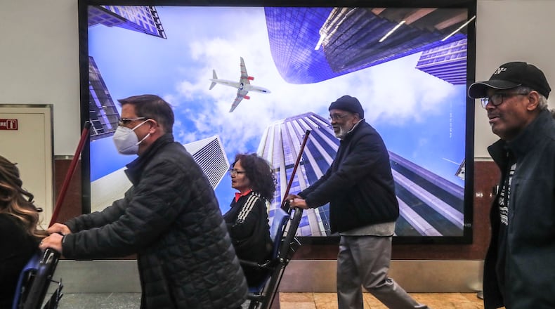 November 17, 2023 Hartsfield-Jackson International Airport: Air Travelers filled the airport Friday, Nov. 17, 2023. (John Spink / John.Spink@ajc.com)
