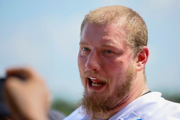 Falcons offensive tackle Kaleb McGary, shown here at training camp on Thursday, July 24, 2025, went down with an injury on the practice field Wednesday. (Miguel Martinez/AJC)