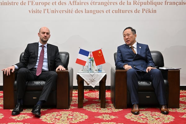 French Foreign Minister Jean-Noel Barrot, left, meets with Duan Peng President of the Beijing Language and Culture University (BLCU), in Beijing, Thursday, March 27, 2025. (Adek Berry/Pool Photo via AP)
