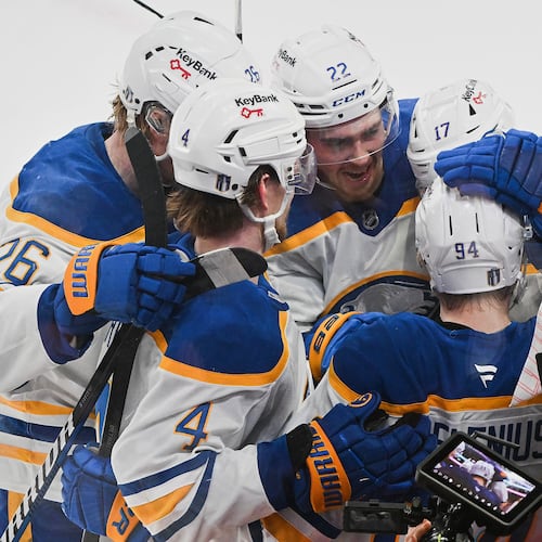 Buffalo Sabres' Konsta Helenius (94) celebrates with teammates after scoring against the Montreal Canadiens during the second period of Game 6 in a second-round NHL hockey Stanley Cup playoff series in Montreal, Saturday, May 16, 2026. (Graham Hughes/The Canadian Press via AP)