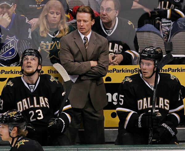 FILE - Dallas Stars head coach Glen Gulutzan, center, during the first period of an NHL Hockey game against the St. Louis Blues, April 7, 2012, in Dallas. (AP Photo/Brandon Wade, file)