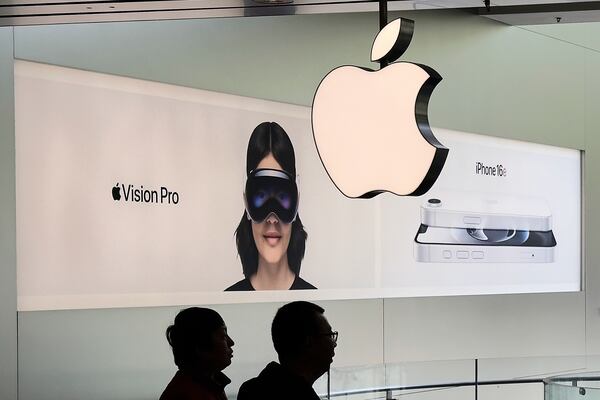 Chinese people visit an Apple Store, inside a shopping mall, in Beijing, Thursday, April 10, 2025. (AP Photo/Andy Wong)