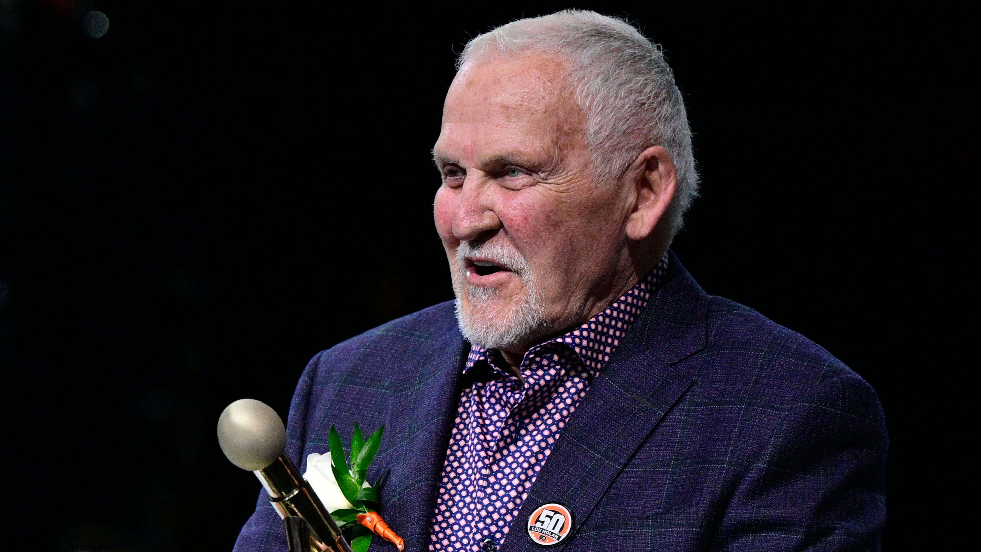 FILE - Former Philadelphia Flyers goalie Bernie Parent during a ceremony for public address announcer Lou Nolan prior to an NHL hockey game against the Anaheim Ducks, Saturday, April 9, 2022, in Philadelphia. (AP Photo/Derik Hamilton, File)