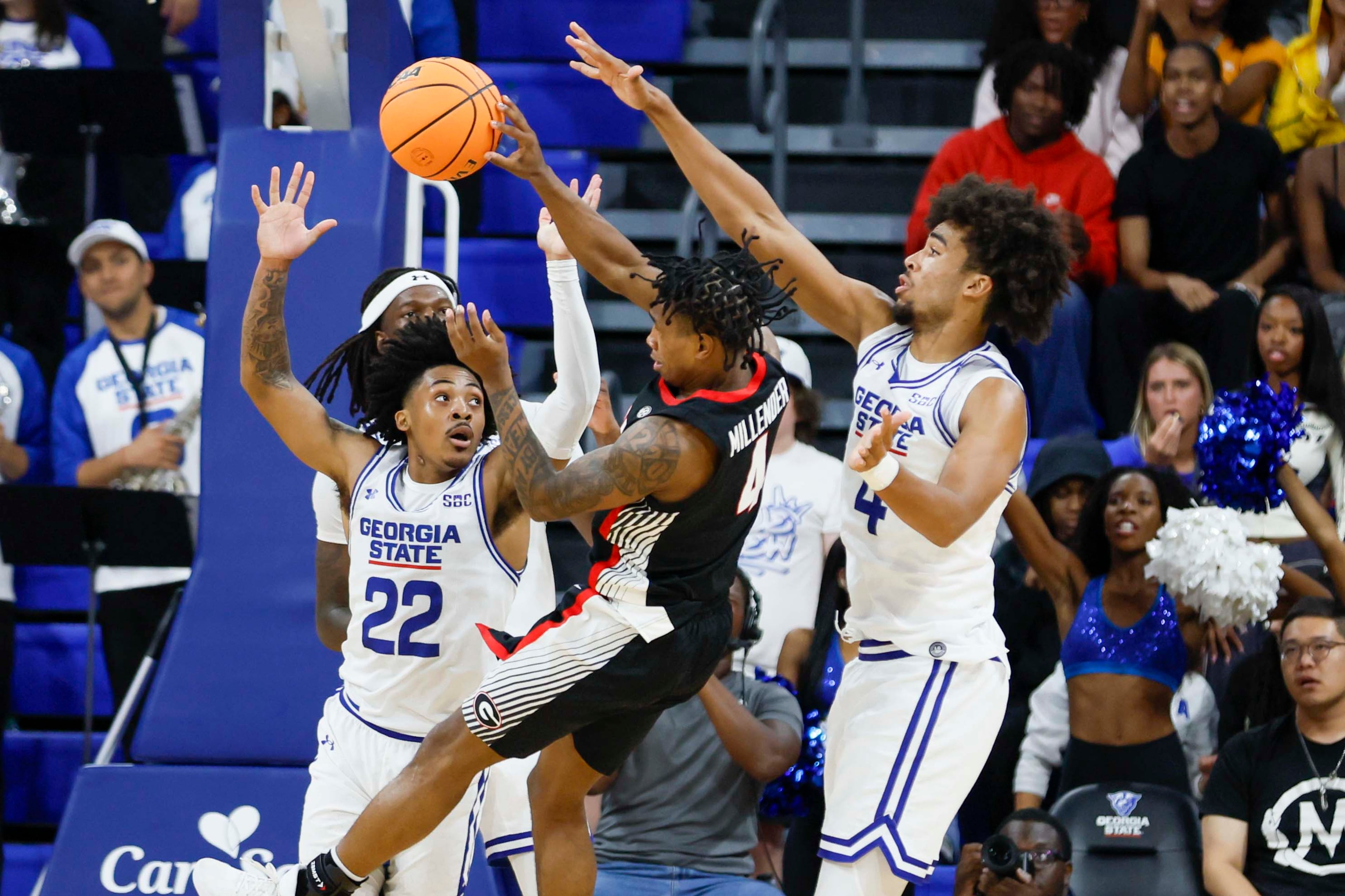 Georgia State Panthers guard Malachi Brown (22) and Georgia State Panthers forward Trey Scott III (4) attempt to block Georgia Bulldogs guard Marcus Millender (4) during the second half of an exhibition opener at the Georgia State Convocation Center, Wednesday, October 15, 2025, in Atlanta.
(Miguel Martinez/ AJC)