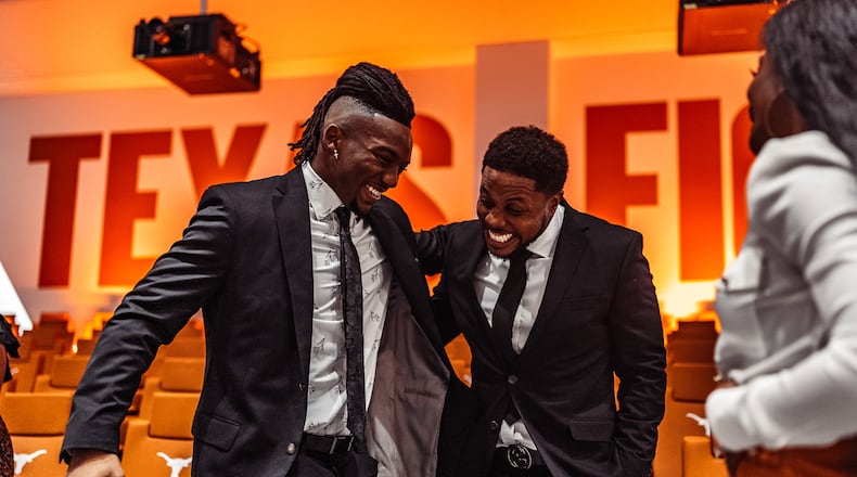 Texas Longhorns running backs coach Tashard Choice (right) laughs with running back Bijan Robinson after Robinson was named the winner of the Doak Walker Award as the nation's top running back for the 2022 season. Robinson was selected as the Falcons' first-round draft choice April 27, 2023. (Texas Football)