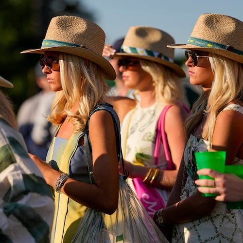 Patrons watch on the 17th hole during the third round of the Masters golf tournament at the Augusta National Golf Club, Saturday, April 11, 2026, in Augusta, Ga. (AP Photo/Gerald Herbert)