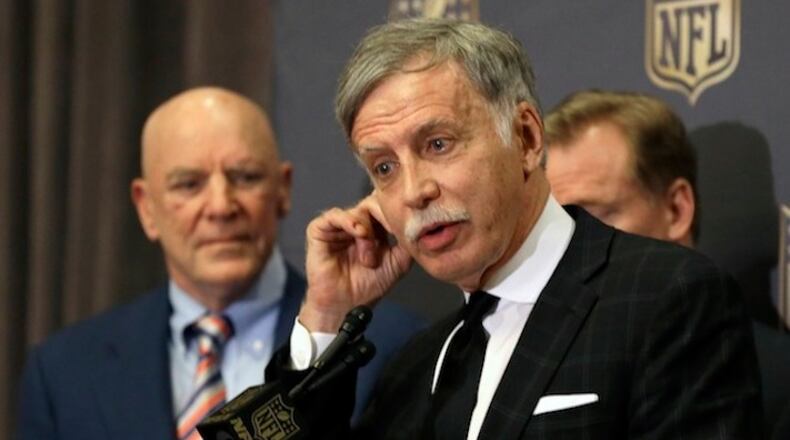St. Louis Rams owner Stan Kroenke talks to the media after team owners voted Tuesday, Jan. 12, 2016, in Houston to allow the Rams to move to a new stadium just outside Los Angeles, and the San Diego Chargers will have an option to share the facility. Houston Texans owner Bob McNair stands to his left. (AP Photo/Pat Sullivan)