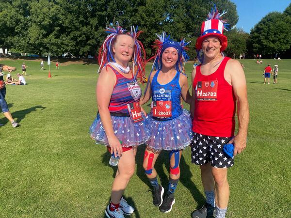 Cinnamon, Hillary and Michael Blozer ran The Atlanta Journal-Constitution Peachtree Road Race as a family for the first time. (Photo: Sarah Kallis/AJC)