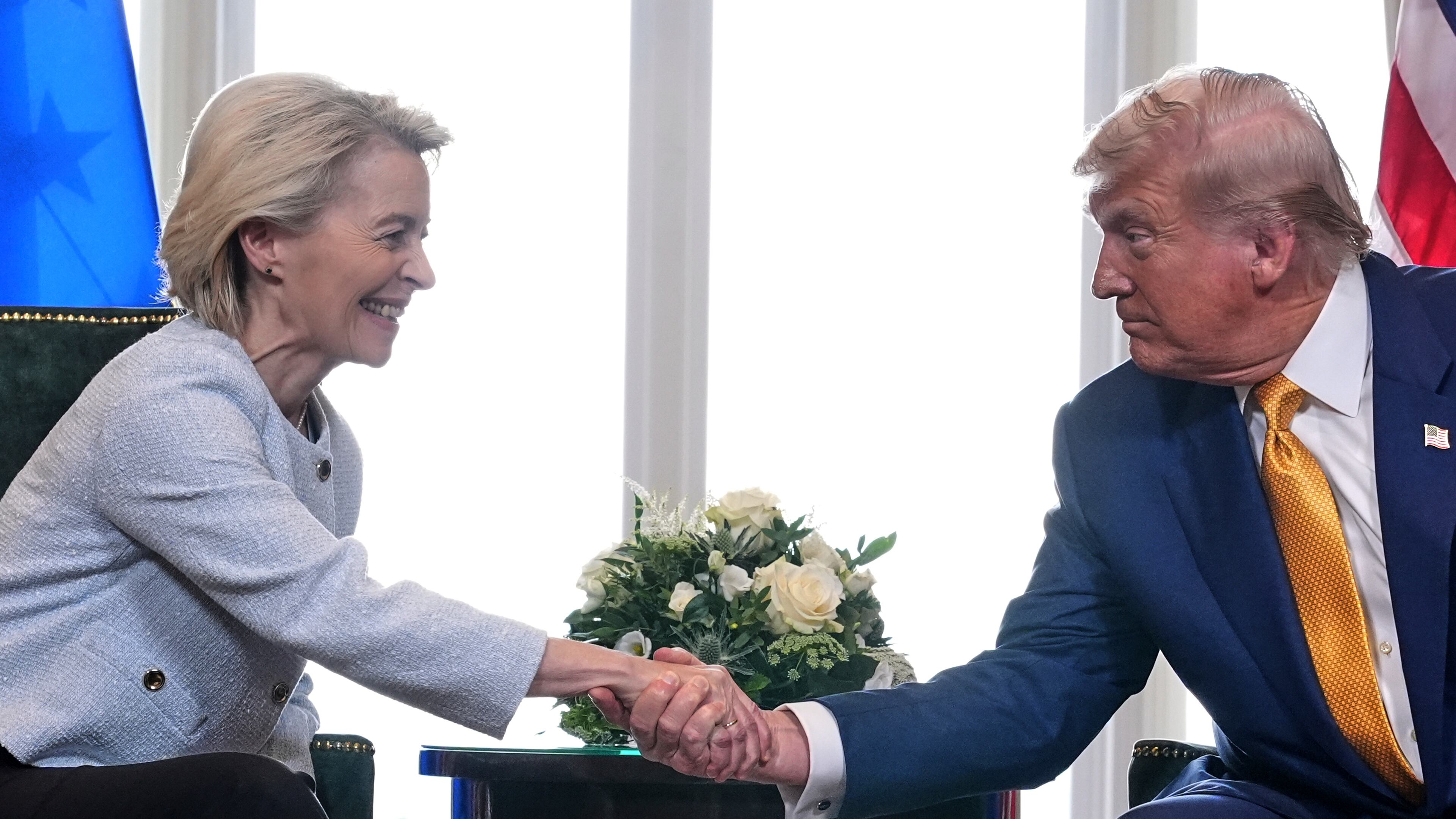 President Donald Trump and European Commission President Ursula von der Leyen shake hands after reaching a trade deal at the Trump Turnberry golf course in Turnberry, Scotland Sunday, July 27, 2025. (AP Photo/Jacquelyn Martin)