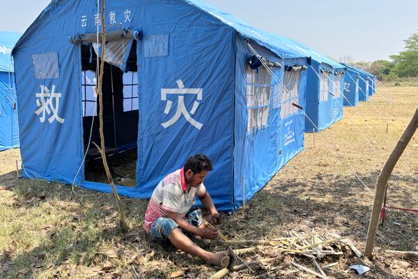 A man works at temporary shelter for displaced people, in the aftermath of the earthquake, in Naypyitaw, Myanmar, Thursday, April 3, 2025. (AP Photo)