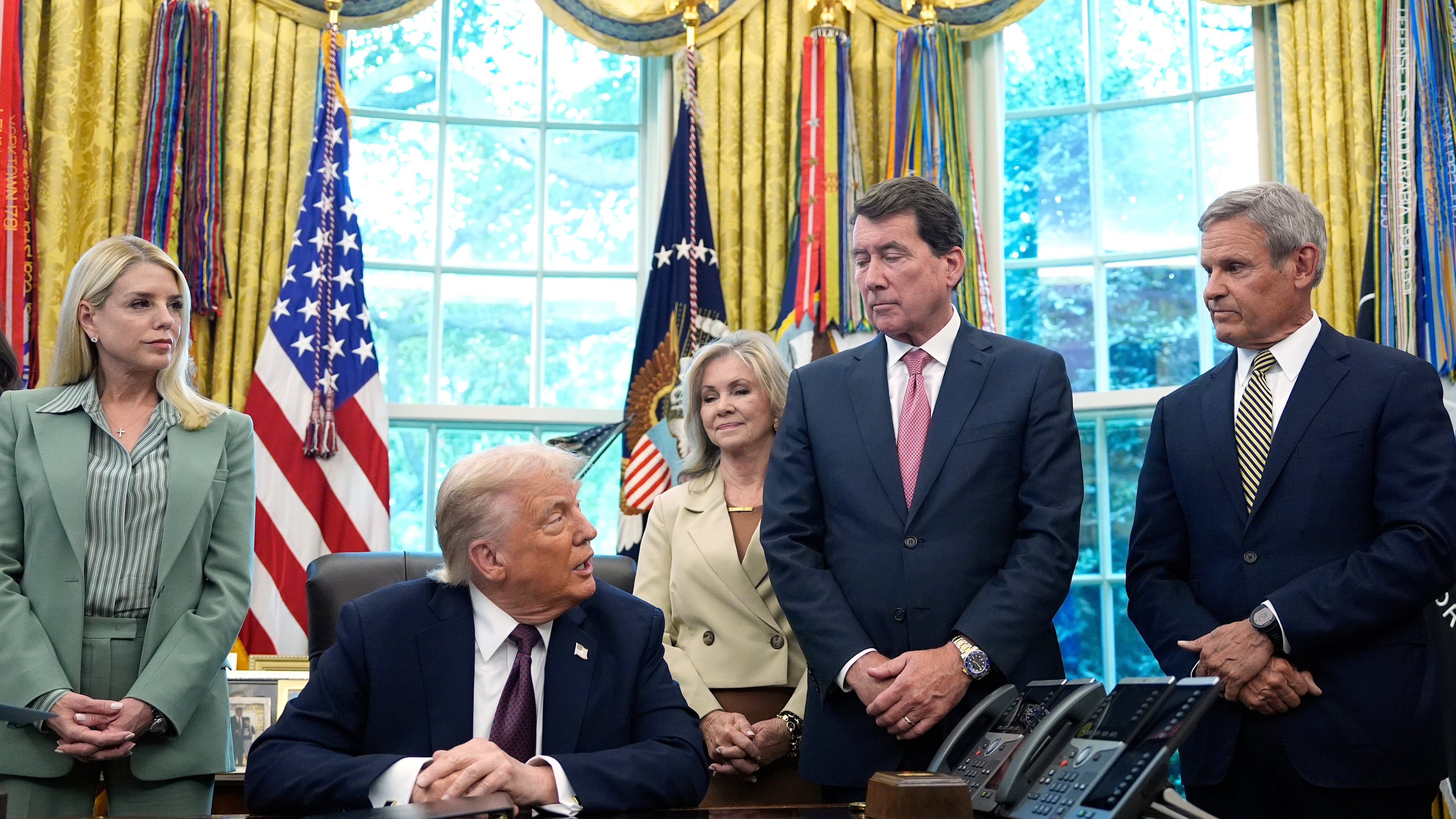 President Donald Trump speaks as Attorney General Pam Bondi, from left, Sen. Marsha Blackburn, R-Tenn., Sen. Bill Hagerty, R-Tenn., and Tennessee Gov. Bill Lee listen in the Oval Office of the White House, Monday, Sept. 15, 2025, in Washington. (AP Photo/Alex Brandon)