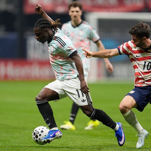 Belgium's Jeremy Doku (11) dribbles against the United States' Christian Pulisic (10) during the first half of an international friendly soccer match, Saturday, March 28, 2026, in Atlanta. (AP Photo/Mike Stewart)