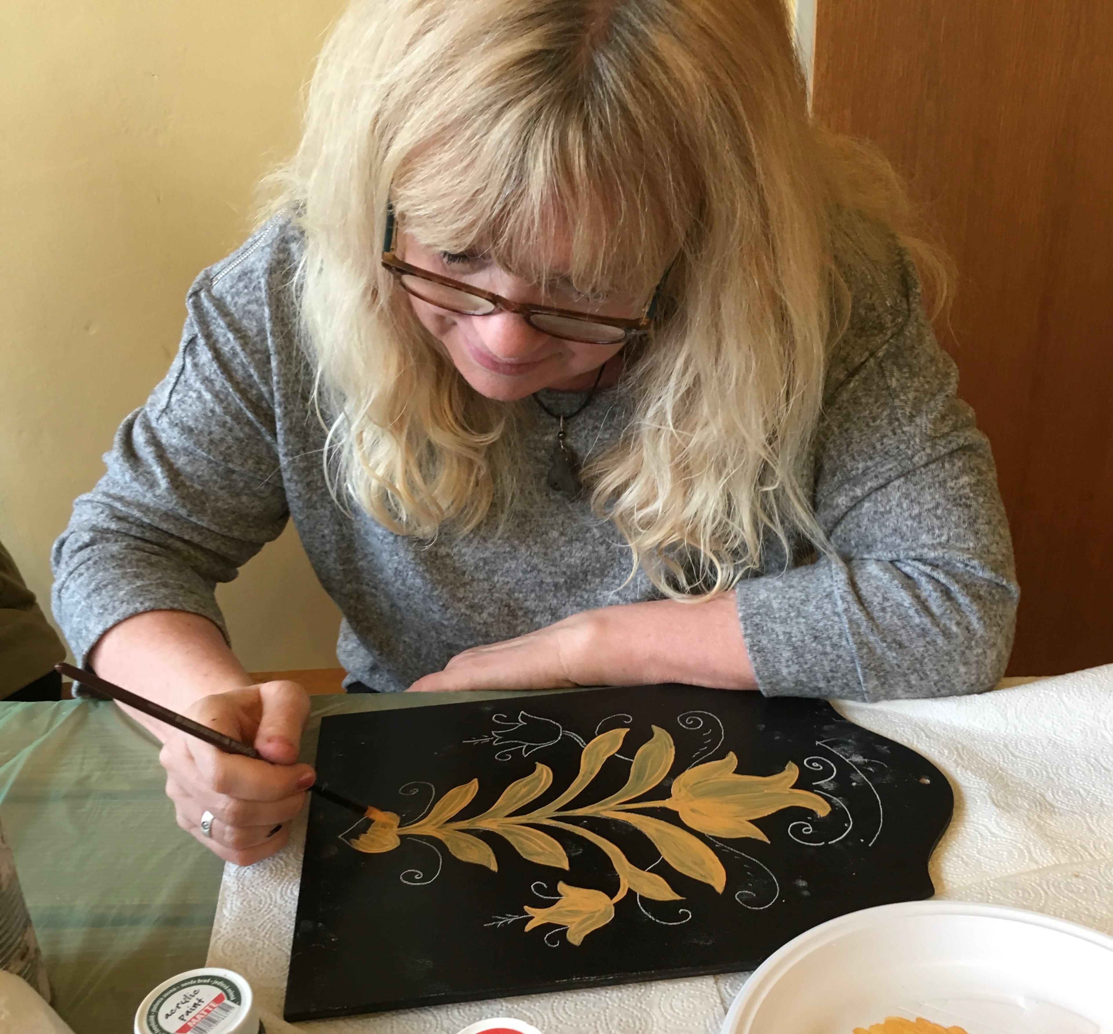 Suzanne Kindler is an American based in Rothenburg, Germany who makes much of her income selling hand-painted artwork like Christmas ornaments on Etsy. However, last month two of her shipments were apparently lost and caught up in tariff rule changes when she tried to ship to the US via UPS. (Sandra Tingle/Courtesy of Suzanne Kindler)