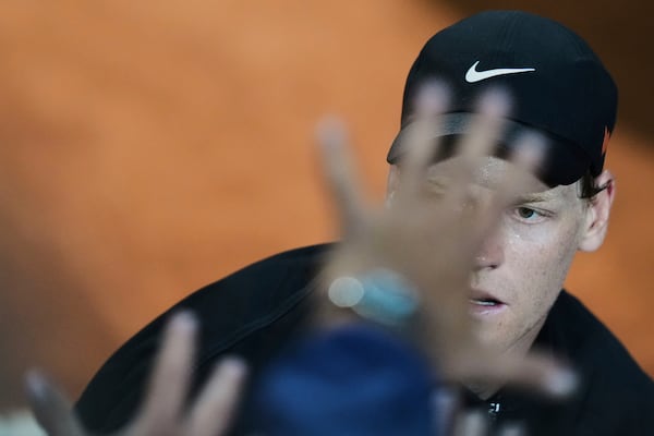 Italy's Jannik Sinner celebrates after defeating Argentina's Francisco Cerundolo in a round of sixteen match against at the Italian Open tennis tournament in Rome, Tuesday, May 13, 2025. (AP Photo/Andrew Medichini)