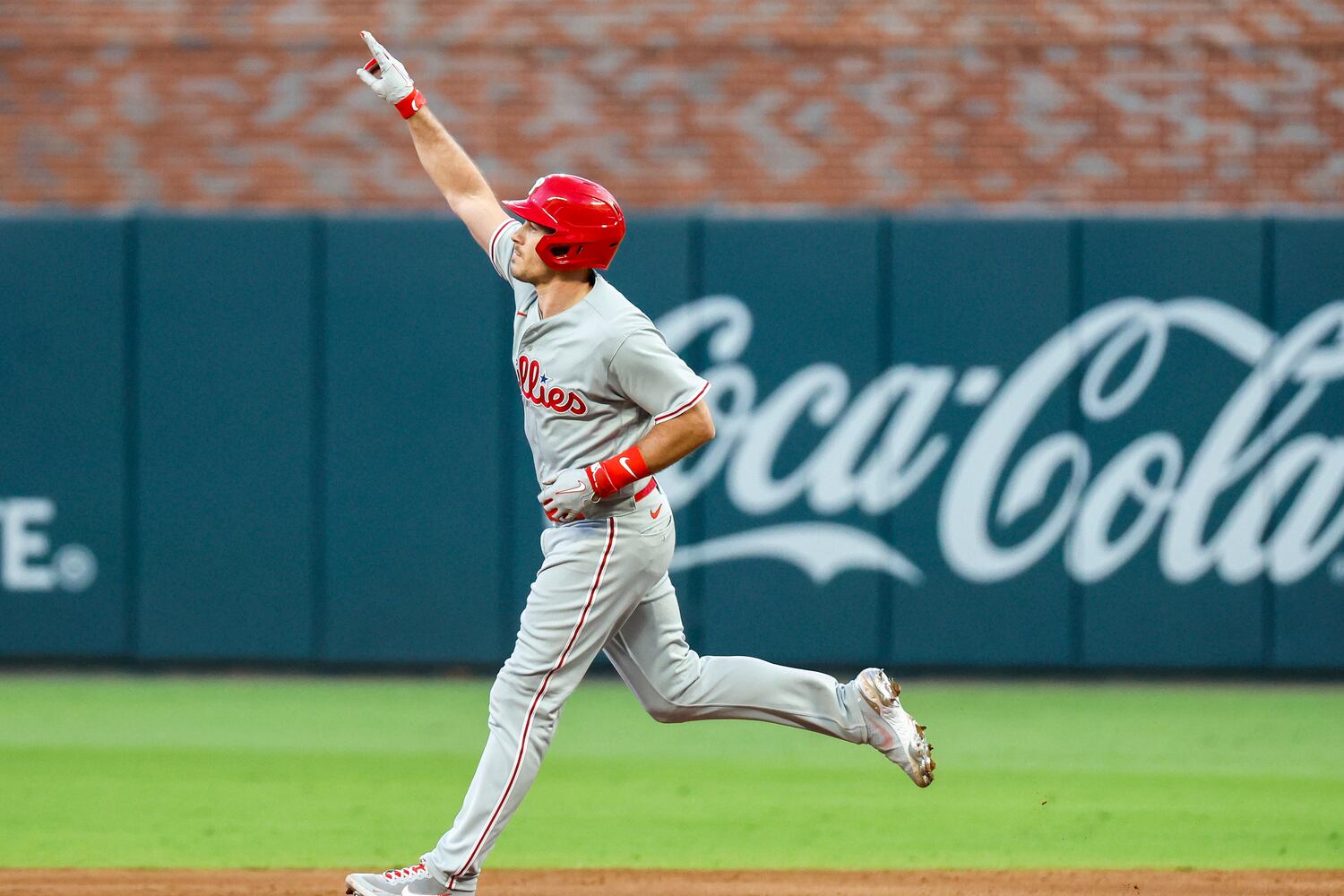Philadelphia Phillies catcher J.T. Realmuto (10) signals a two-run home run against the Atlanta Braves during the second inning of the NLDS Game 2 In Atlanta on Monday, Oct. 9, 2023.   (Miguel Martinez / Miguel.Martinezjimenez@ajc.com)