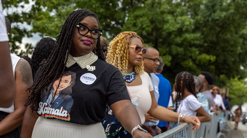 Tiffanie Morris (left) waits outside Georgia State University Convocation Center in Atlanta on Tuesday before a Kamala Harris campaign rally. Democrats and Republicans are both trying to woo younger voters. (Arvin Temkar / AJC)