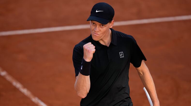 Jannik Sinner, of Italy, celebrates winning a point against Casper Ruud, of Norway, during the final match at the Italian Open tennis tournament, in Rome, Sunday, May 17, 2026. (AP Photo/Alessandra Tarantino)