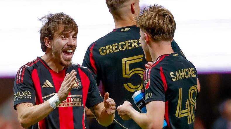 Atlanta United forward Saba Lobjanidze, left, celebrates with midfielder Cooper Sanchez, right after their team defeated CF Montreal in an MLS soccer match, Saturday, May 2, 2026, in Atlanta. (AP Photo/Erik S. Lesser)