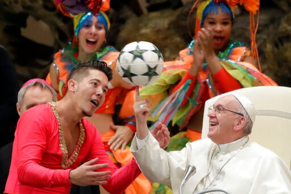 FILE - Pope Francis twirls a soccer ball he was presented by a member of the Circus of Cuba, during his weekly general audience in the Pope Paul VI hall, at the Vatican, Wednesday, Jan. 2, 2019. (AP Photo/Andrew Medichini, file)