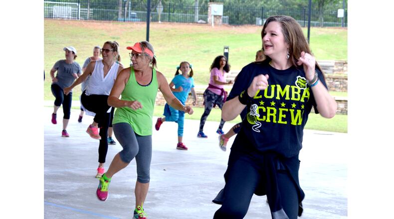 Johns Creek residents work out in a Zumba routine at Newtown Park. The city is seeking a volunteer to serve on the Recreation and Parks Advisory Board. CITY OF JOHNS CREEK via Facebook