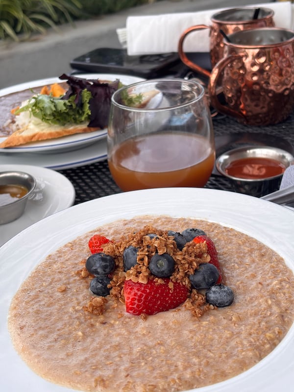 A bowl of oatmeal topped with berries