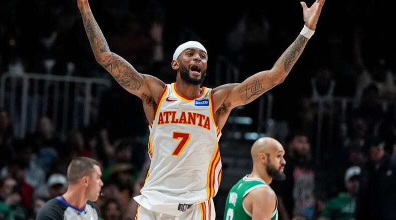 Atlanta Hawks guard Nickeil Alexander-Walker (7) celebrates his three-point shot against the Boston Celtics in the second half of an NBA basketball game, Monday, March 30, 2026, in Atlanta. (AP Photo/Mike Stewart)