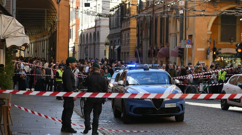 Financial Police patrol a scene after a car incident in a street of Modena, Italy, Saturday, May 16, 2026. (Lapresse via AP)