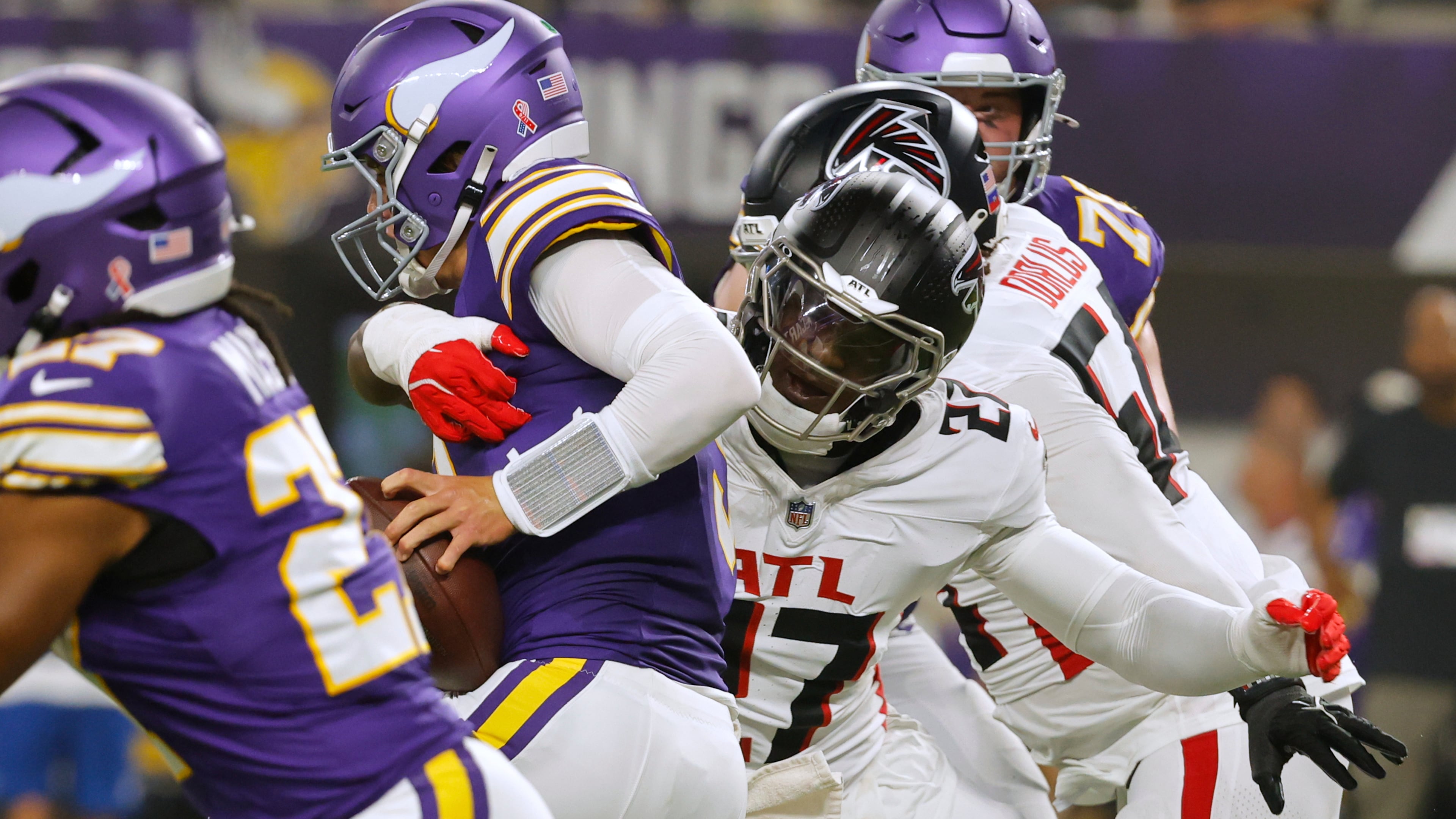 Atlanta Falcons linebacker James Pearce Jr. (27) sacks Minnesota Vikings quarterback J.J. McCarthy (9) during the first half of an NFL football game, Sunday, Sept. 14, 2025, in Minneapolis. (AP Photo/Bruce Kluckhohn)