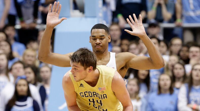 North Carolina's Garrison Brooks guards Georgia Tech's Ben Lammers (44) during the first half of an NCAA college basketball game in Chapel Hill, N.C., Saturday, Jan. 20, 2018. (AP Photo/Gerry Broome)