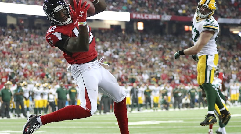 *** POSSIBLE VISUAL LEDE *** October 30, 2016 ATLANTA: — GAME WINNER — Falcons wide receiver Mohamed Sanu catches a touchdown pass from Matt Ryan past Packers defender Jake Ryan for a 33-32 victory in an NFL football game on Sunday, Oct. 30, 2016, in Atlanta. Curtis Compton /ccompton@ajc.com