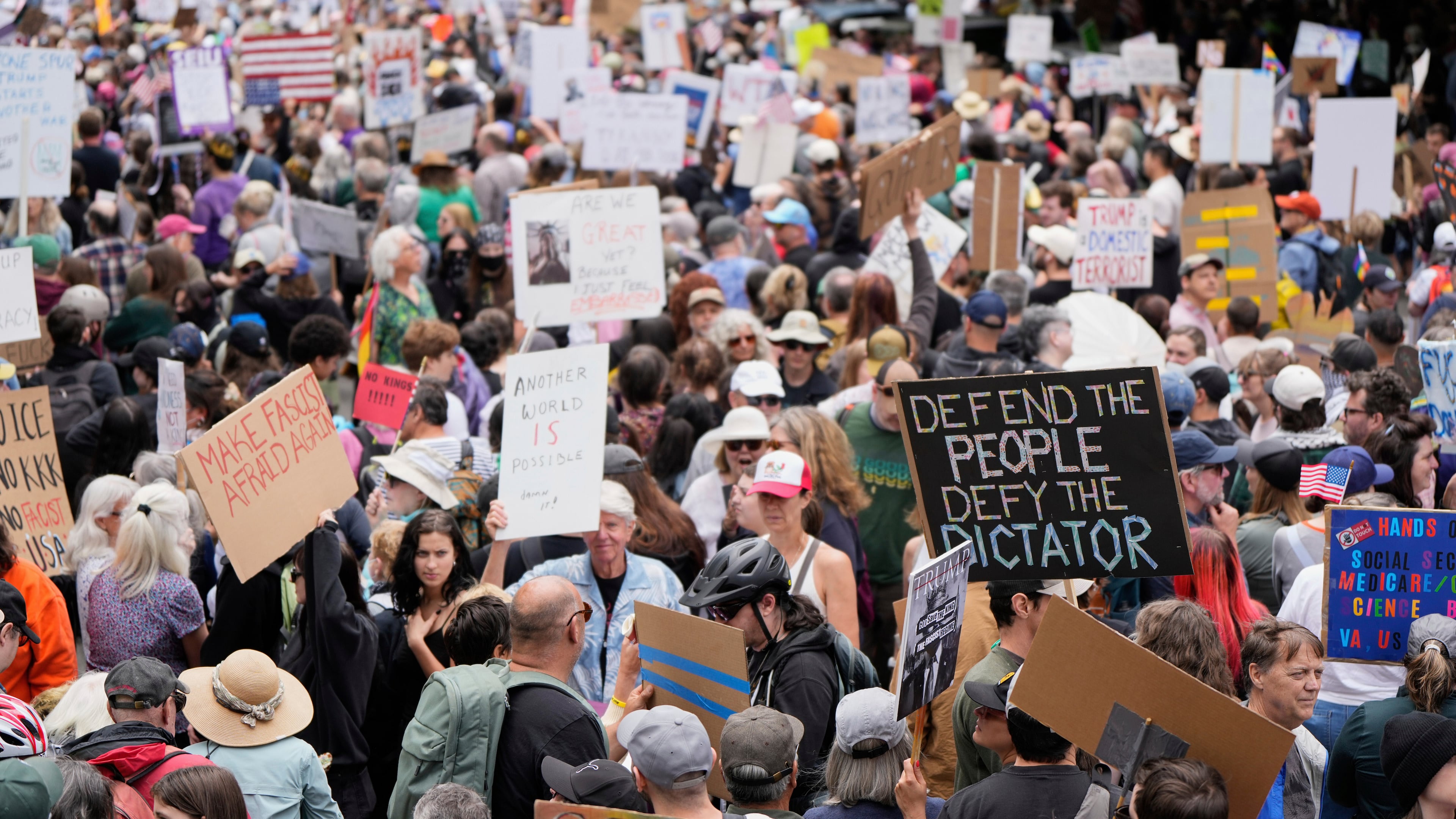 FILE - Demonstrators take part in the "No Kings" protest, June 14, 2025, in Portland, Ore. (AP Photo/Jenny Kane, File)