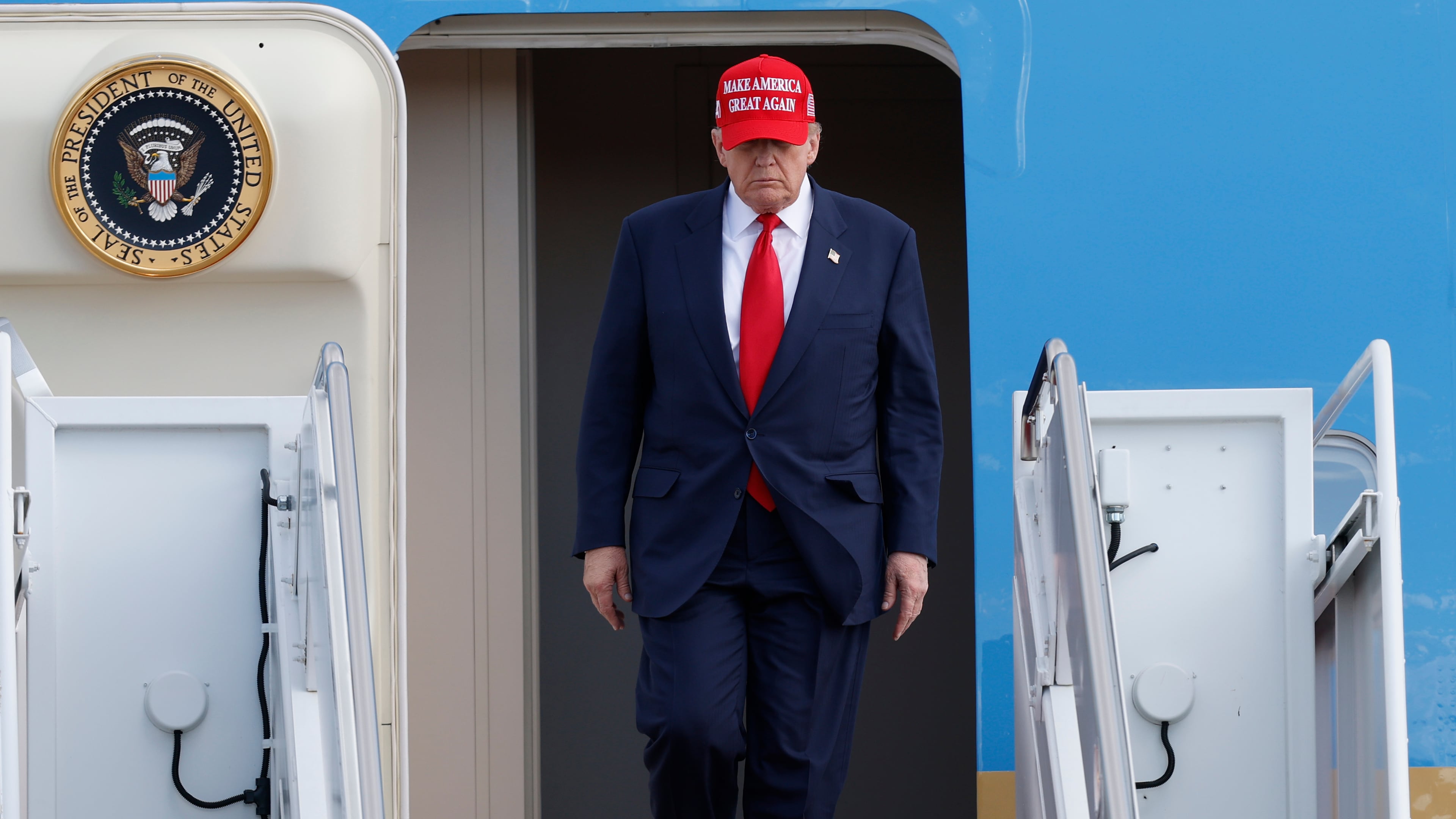 President Donald Trump walks down the stairs of Air Force One upon his arrival at Joint Base Andrews, Md., Thursday, Oct. 30, 2025, after returning from Asia. (AP Photo/Luis M. Alvarez)