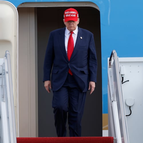 President Donald Trump walks down the stairs of Air Force One upon his arrival at Joint Base Andrews, Md., Thursday, Oct. 30, 2025, after returning from Asia. (AP Photo/Luis M. Alvarez)