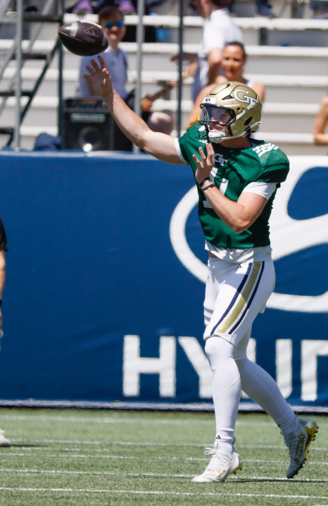 Quarterback Graham Knowles (14) lets loose during Georgia Tech football team's annual White and Gold game in Atlanta on Saturday, April 12, 2025.  Players split into two teams — Team Swarm and Team Wreck ‘Em — with some players being asked to play on both squads.  (Bob Andres for the Atlanta Journal Constitution)