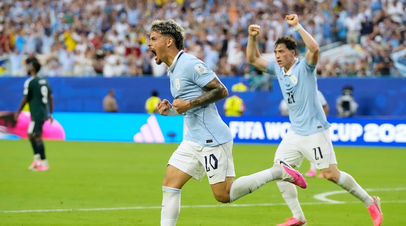 Uruguay's Maxi Araujo celebrates scoring his side's opening goal against Saudi Arabia during a World Cup Group H soccer match in Miami Gardens, Fla., Monday, June 15, 2026. (AP Photo/Lynne Sladky)