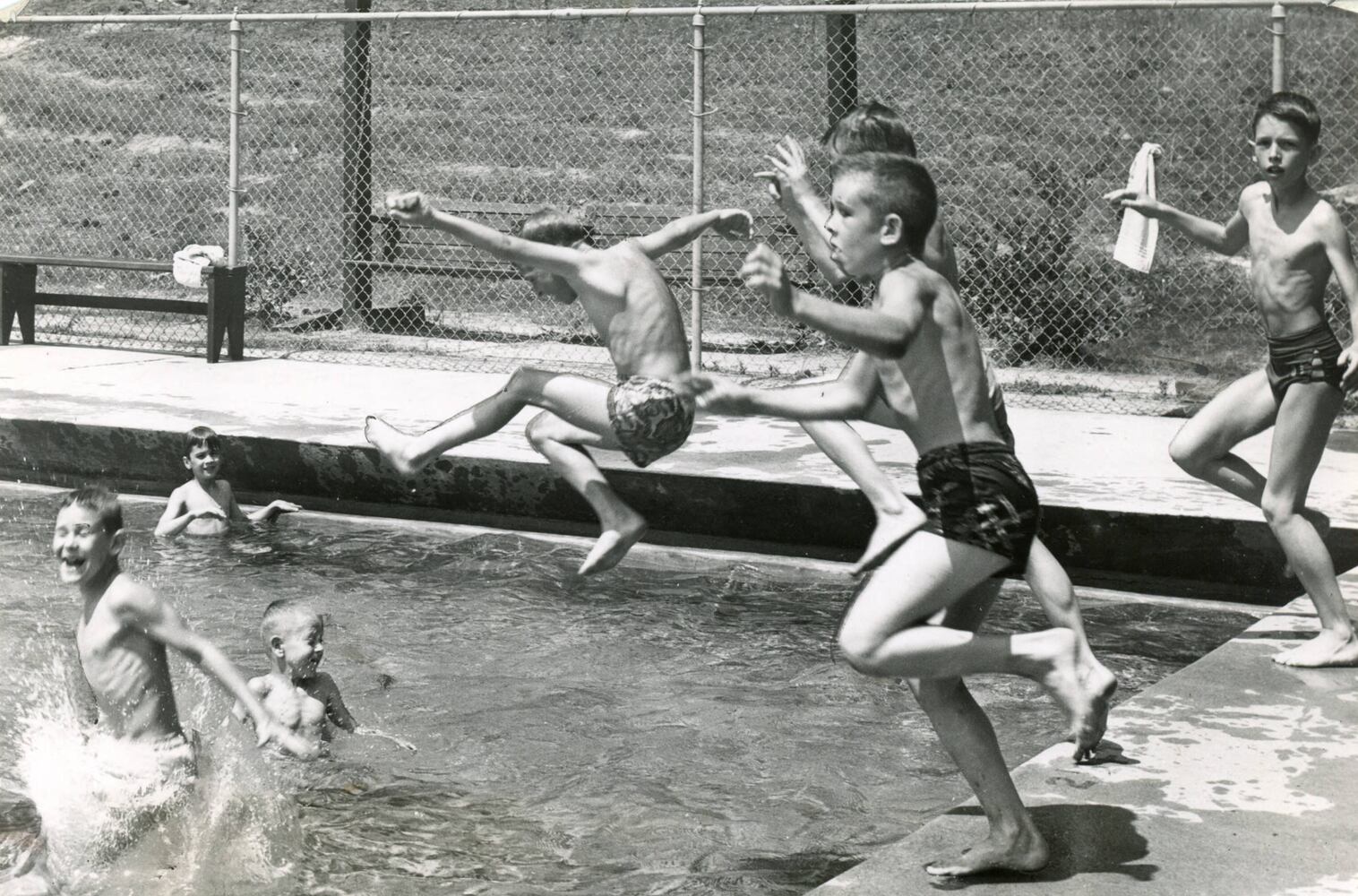 School kids jumping into swimming pool, Atlanta, 1953