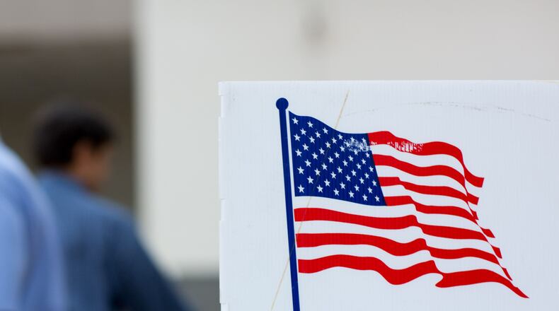 A sign is displayed at Grady High School during the primary runoff election, Tuesday, July 26, 2016, in Atlanta. BRANDEN CAMP/SPECIAL