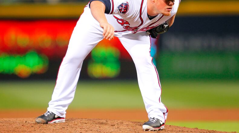 Atlanta Braves relief pitcher Craig Kimbrel prepares to wind up and deliver in the ninth inning of the baseball game against the New York Mets, Wednesday, April 9, 2014, in Atlanta. The Braves won the game 4-3. (AP Photo/Todd Kirkland)