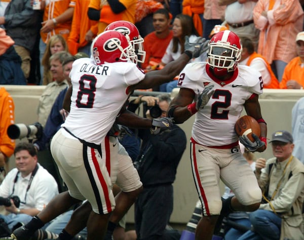 Paul Oliver (left) and DeMario Minter celebrate an interception. (Phil Skinner/AJC)