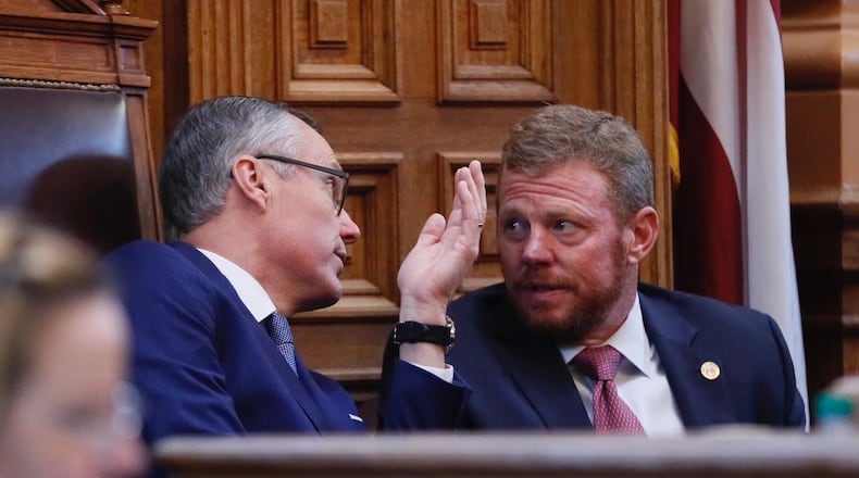 Lt. Gov. Casey Cagle speaks with Chris Riley, Gov. Nathan Deal's top aide, about the Delta tax break. Bob Andres/AJC