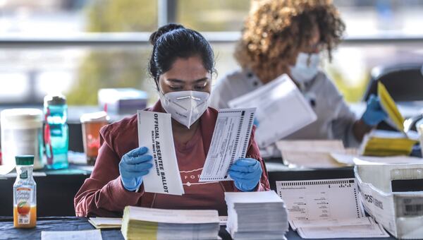 Fulton County election workers count and scan ballots in November 2020. (John Spink/AJC)