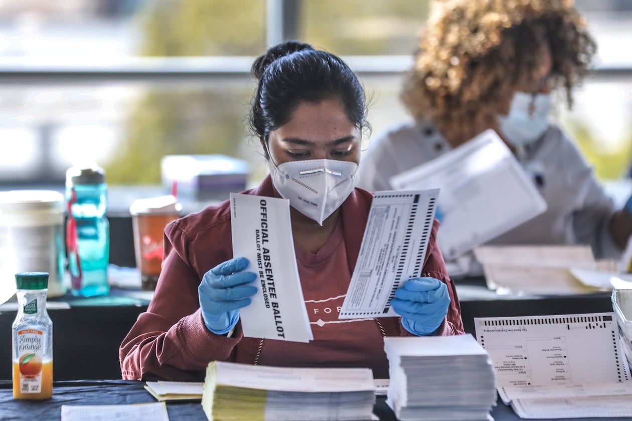 Fulton County elections workers sort and count absentee ballots during the county's second recount of Presidential Election Day ballots at the Georgia World Congress Center on Nov. 25, 2020. (John Spink/AJC file)