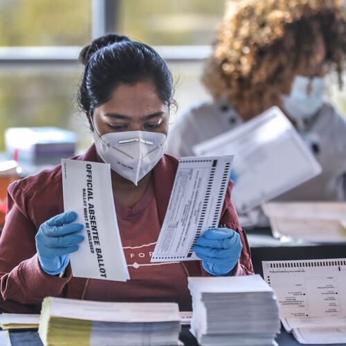 Fulton County election workers count and scan ballots on Wednesday, Nov. 4, 2020, as people across the state and nation eagerly waited to see the results of the general election in the county. (John Spink/AJC)