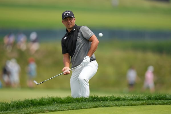 Xander Schauffele chips onto the 13th green during the second round of the U.S. Open golf tournament at Oakmont Country Club Friday, June 13, 2025, in Oakmont, Pa. (AP Photo/Seth Wenig)