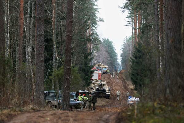 Military road and other equipment are seen parked at a training range in Pabrade, north of the capital Vilnius, Lithuania on Thursday, March 27, 2025. (AP Photo/Mindaugas Kulbis)
