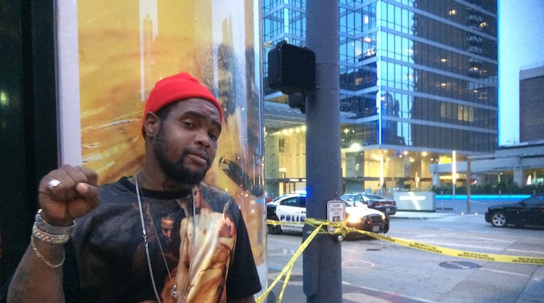 Keon Collins does not condone the sniper attacks but walked past police officers with his middle finger raised as a statement against police brutality in general. Photo: Jennifer Brett